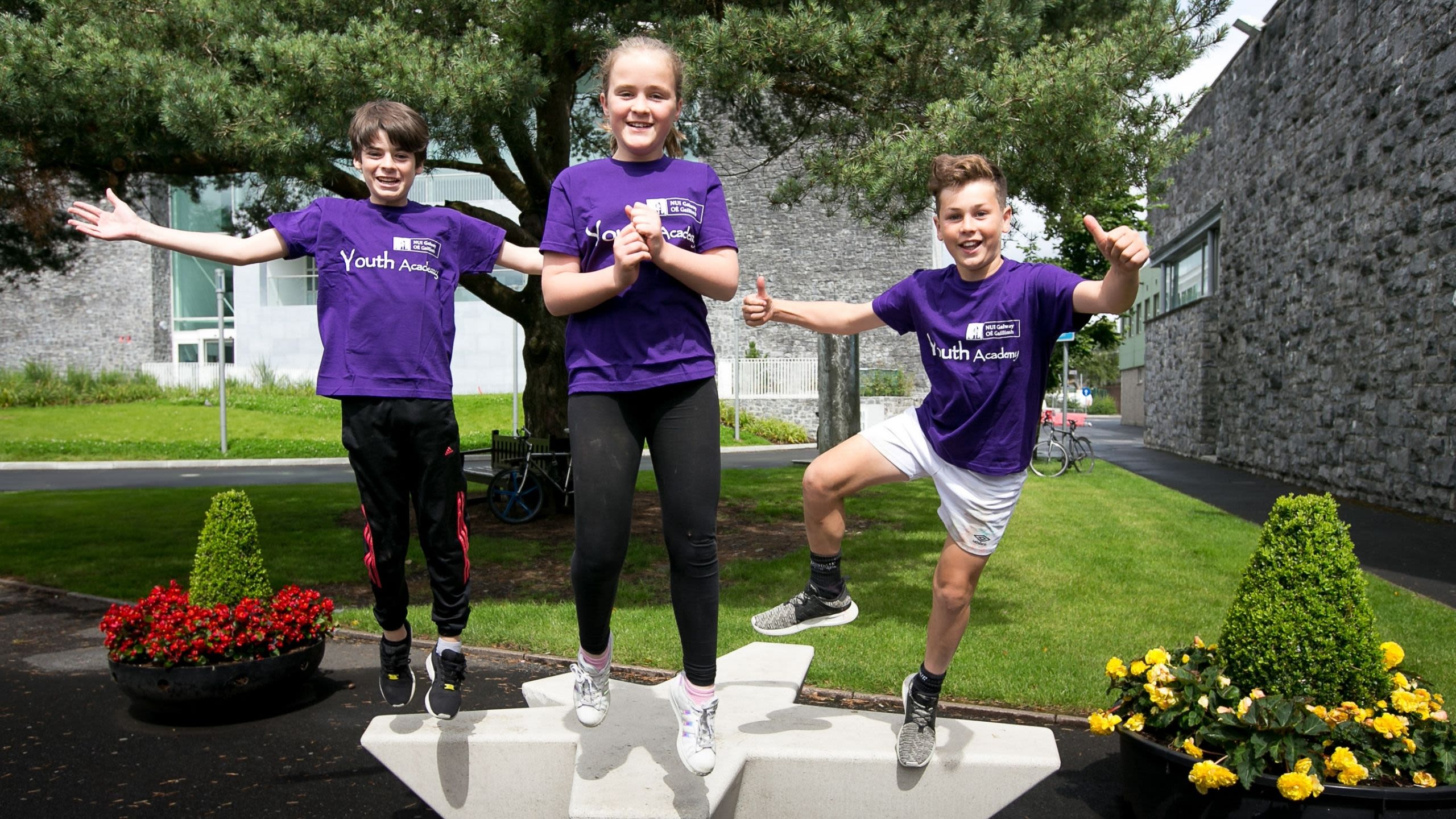 Image of two boys and a girl who took part in the Youth Academy